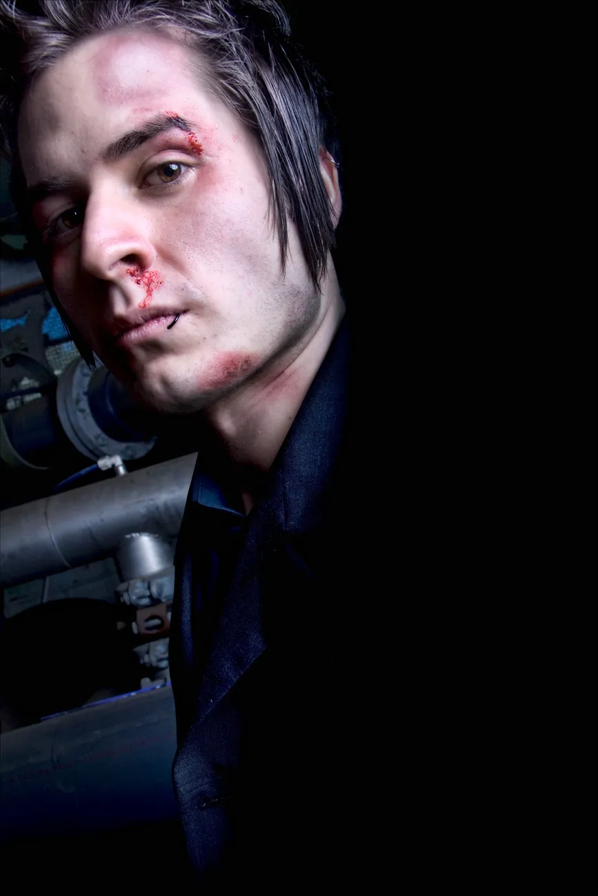 Bruised brow and bloody nose in a pipe room