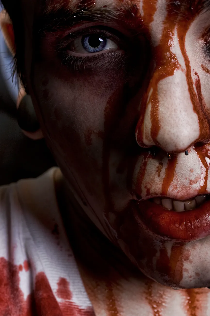 Close-up of blood running down a face