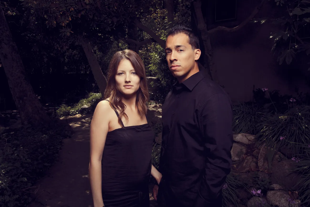Couple in a garden, dressed in black