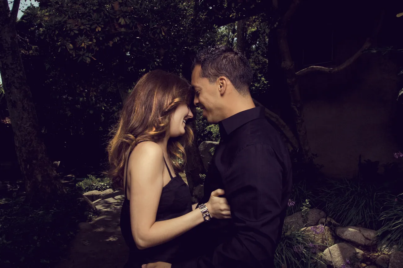 Couple laughing, foreheads together
