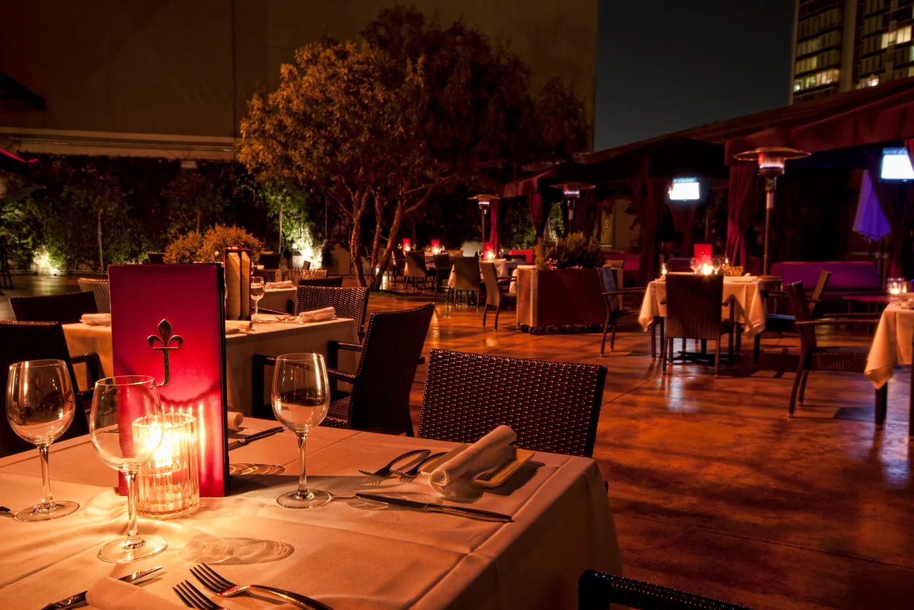 Candlelit table setting with menu
