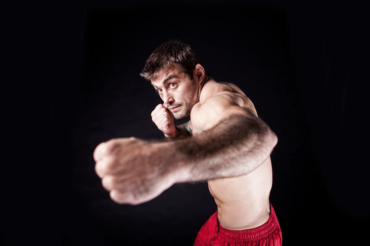 Ricardo, fist toward camera